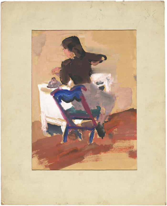 [Woman seated at table]