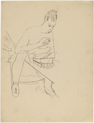 [Woman seated at table]