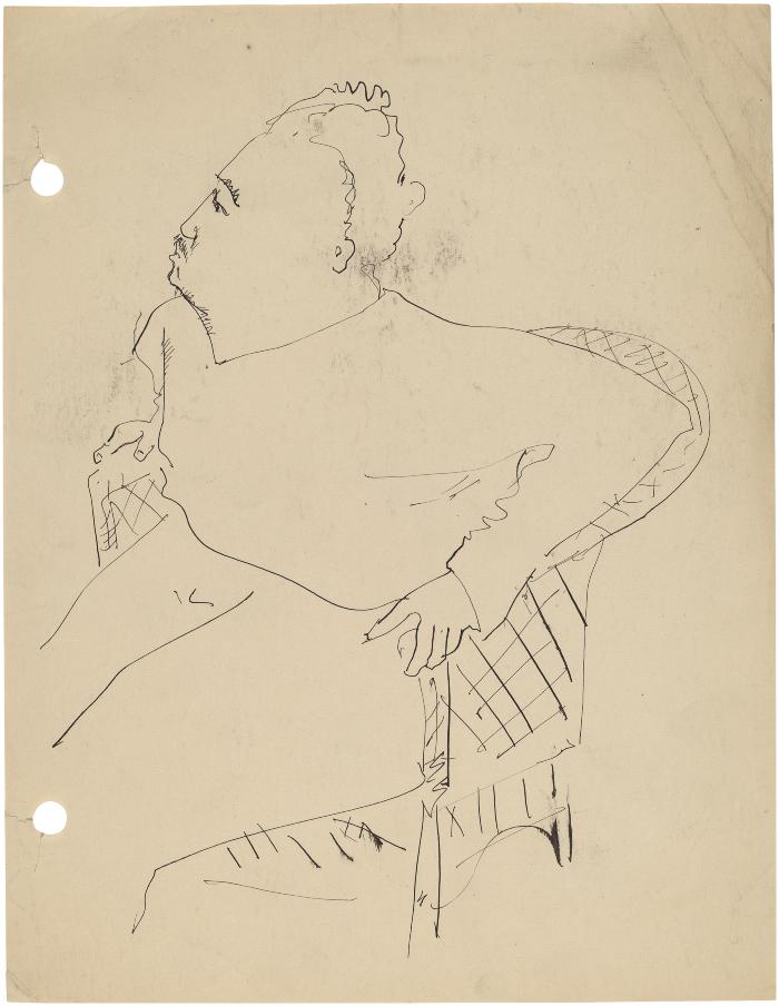 [Man in wicker chair]