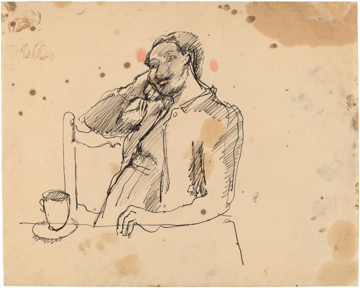 [Woman seated at table]
