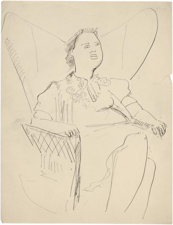 [Seated woman in wingback rocking chair]