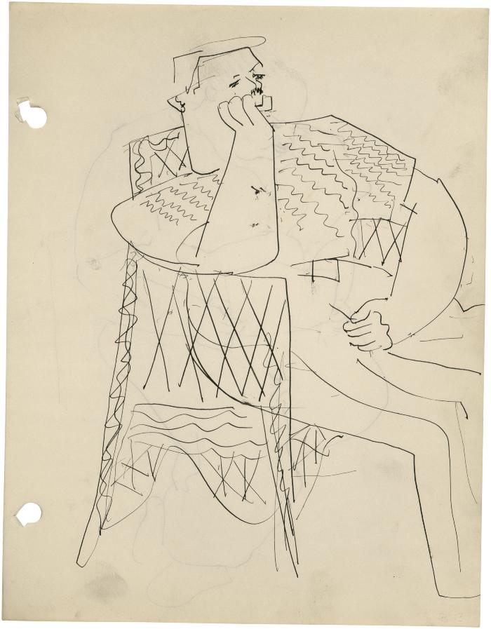 [Man in wicker chair]